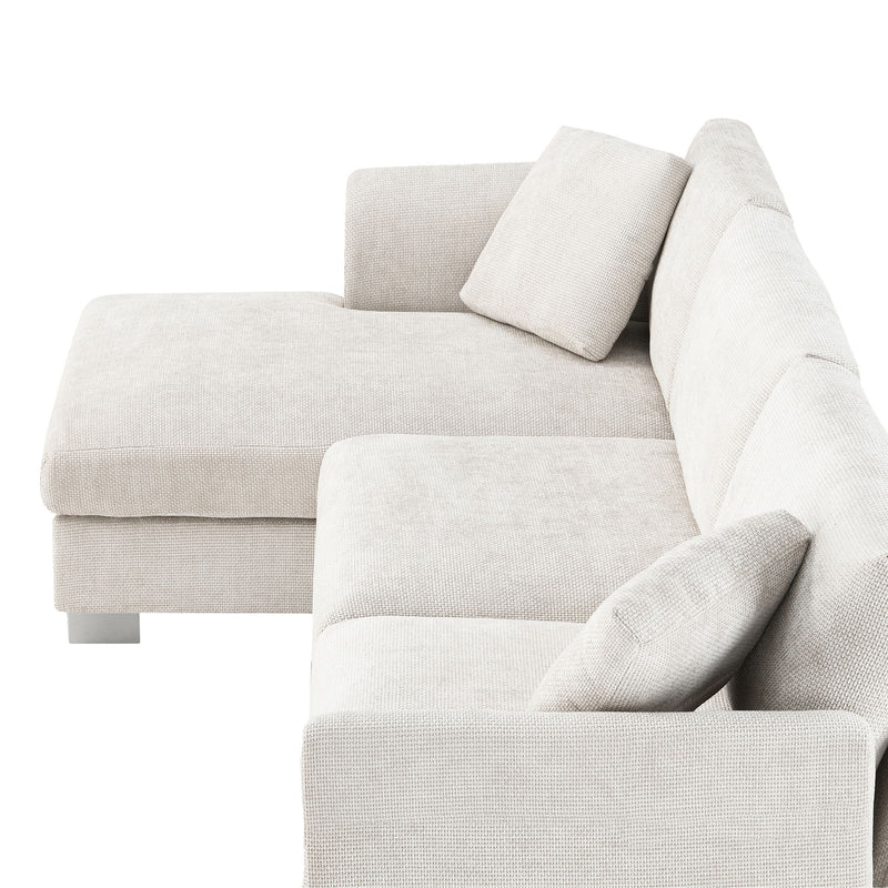 Luxe & Co. modern cloud L-shaped sectional sofa set with oversized chaise, four seats, and two decorative pillows in a contemporary living room