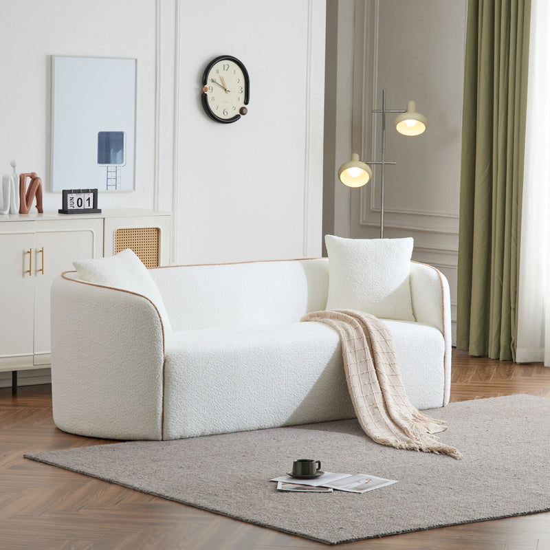 Noble House Coral curved 3-seater stationary sofa with plush cushions and modern design, ideal for contemporary living rooms.