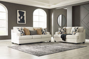 Benchcraft® Heartcort living room set with stationary chair and matching ottoman, featuring plush upholstery and modern design.