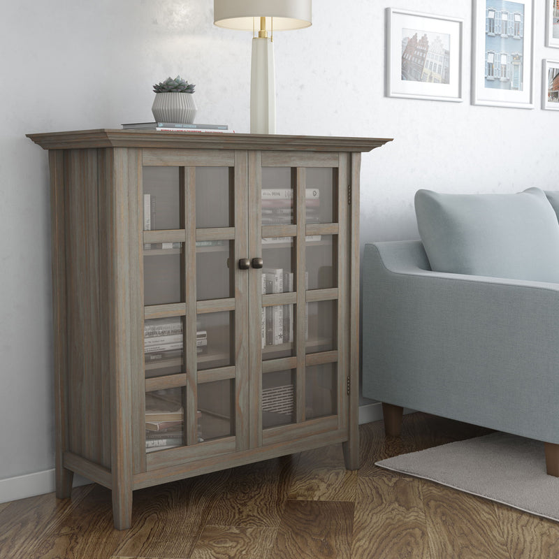 Handcrafted Acadian medium storage cabinet by Simpli-Home, featuring natural wood finish and cabinet doors for stylish organization.
