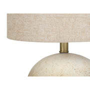 8th Street table lamp with a modern design, featuring a sleek base and a fabric lampshade, ideal for home or office lighting.