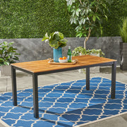 Black rectangular outdoor dining table with iron legs from Noble House, perfect for patio or garden seating arrangements.