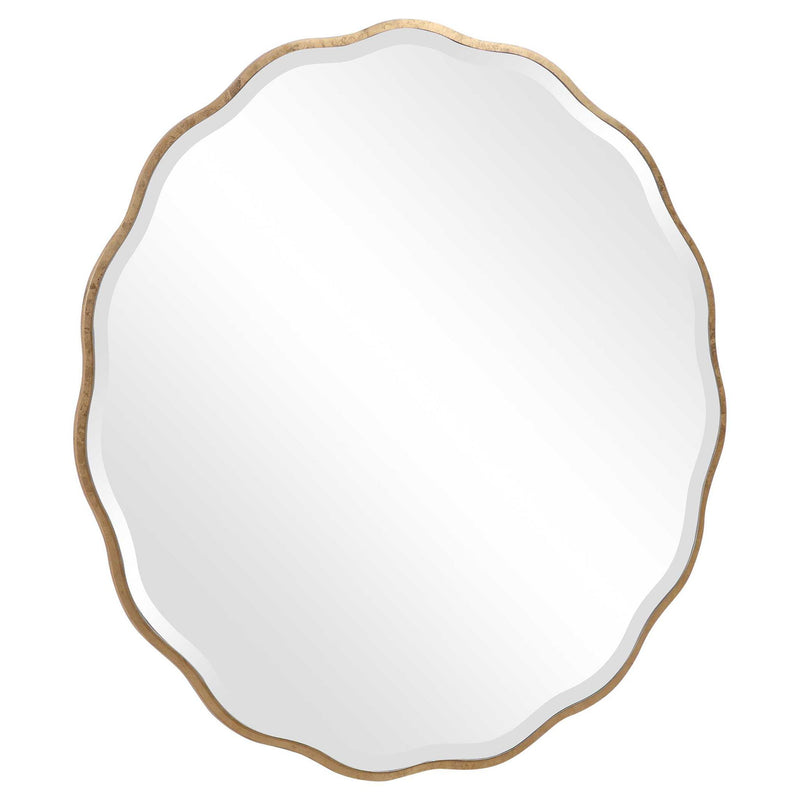 Uttermost Aneta round wall mirror with a sleek frame, hanging on a wall, showcasing its modern design and reflective surface.