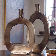 Set of two Uttermost Kyler textured bronze vases for decorative display, featuring a modern, sculptural design.