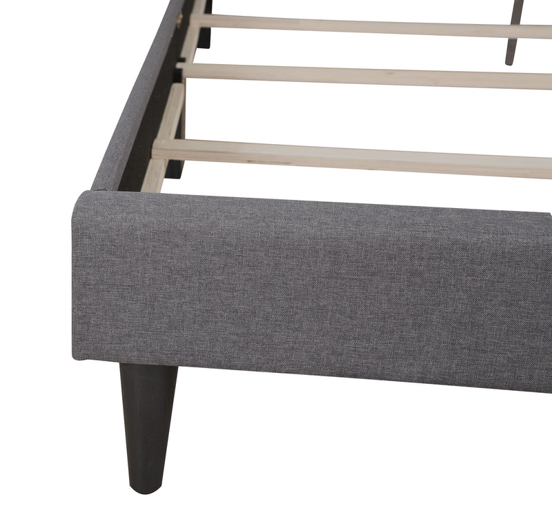 Upholstered tufted bed by Glory Furniture with button-tufted headboard, cozy design, perfect for stylish bedroom decor.