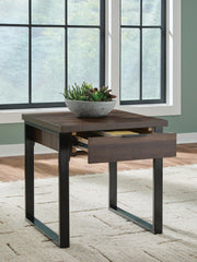 Rectangular Wickman Falls cocktail table by Signature Design by Ashley® with a sleek wood finish and modern design.