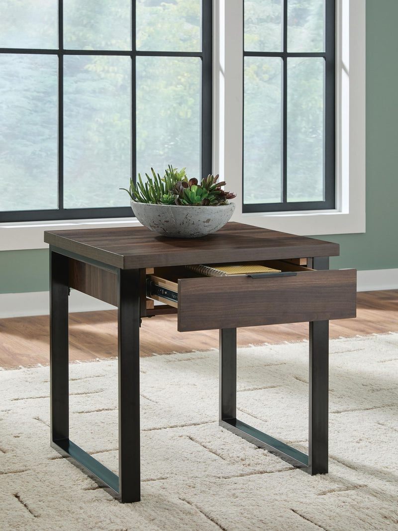 Rectangular Wickman Falls cocktail table by Signature Design by Ashley® with a sleek wood finish and modern design.