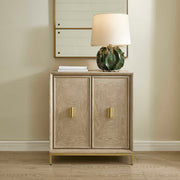 Uttermost Alessia 2-door accent cabinet in light brown wood with sleek, modern design and smooth door handles.