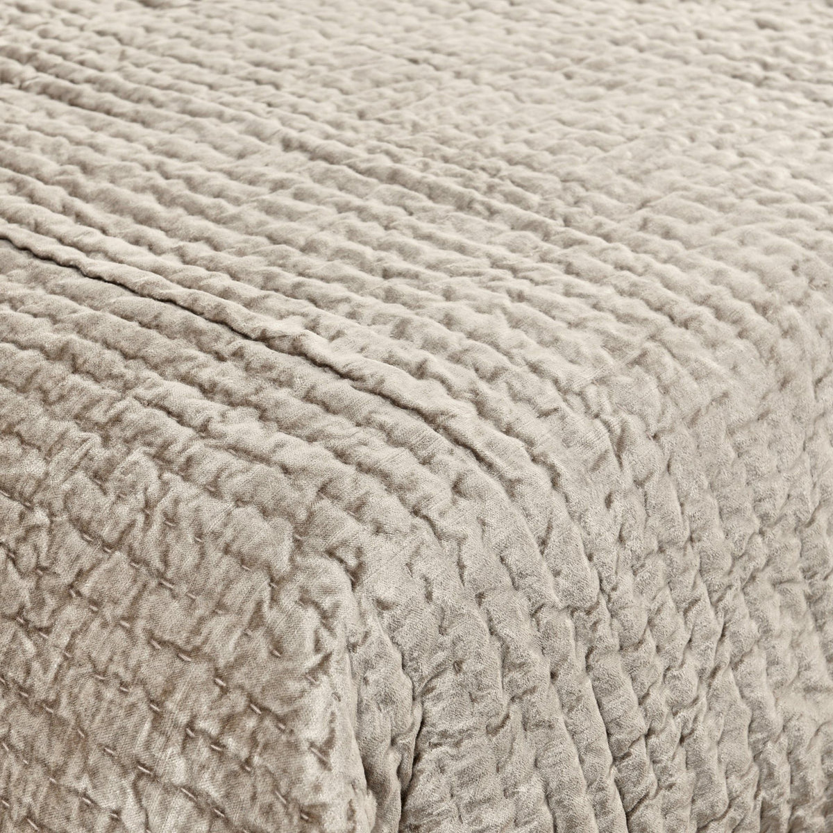 Velvet quilt set with matching shams from Classic Home Bari collection, featuring plush, luxurious fabric in a cozy bedroom setting.