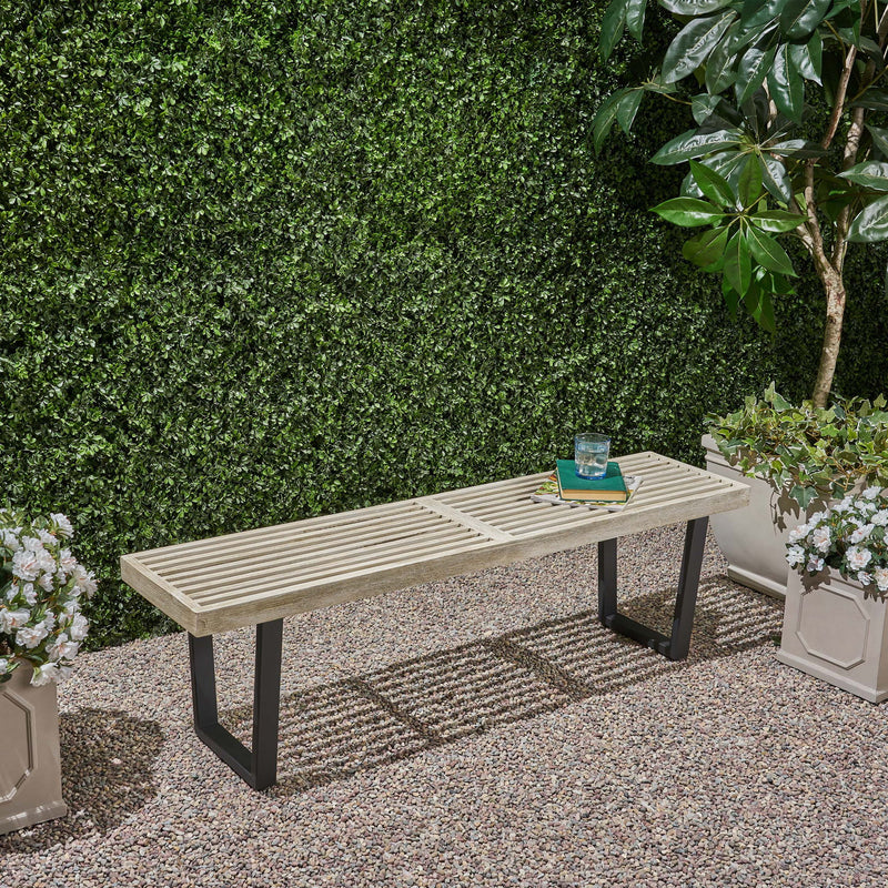 Noble House Intrinsic outdoor dining bench with slat top, weather-resistant wooden bench for garden or patio seating.