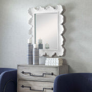 Uttermost sea coral wall mirror with intricate coral-inspired design, round shape, and decorative coastal style.