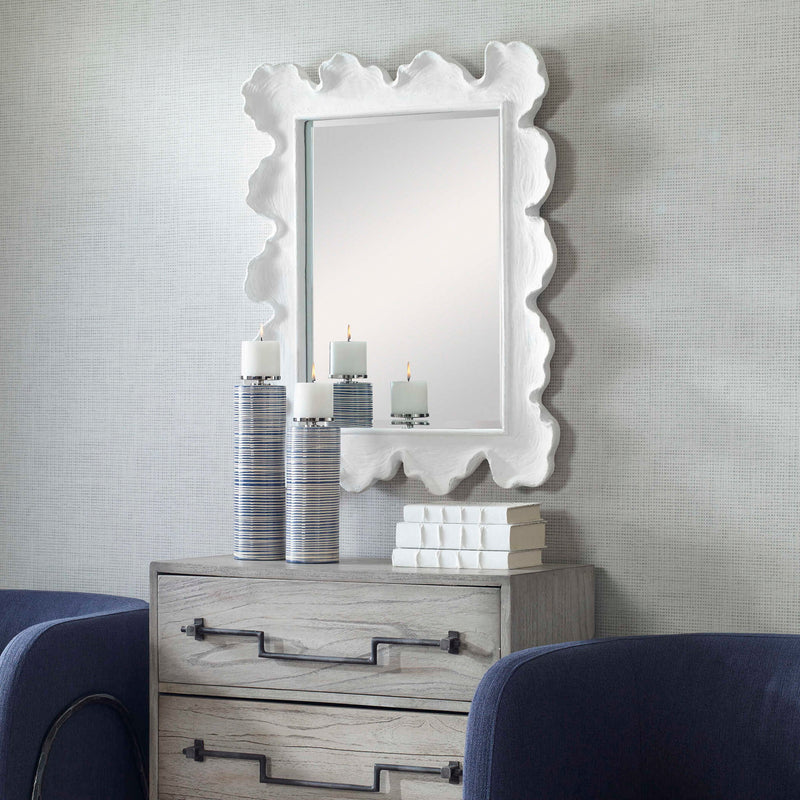 Uttermost sea coral wall mirror with intricate coral-inspired design, round shape, and decorative coastal style.