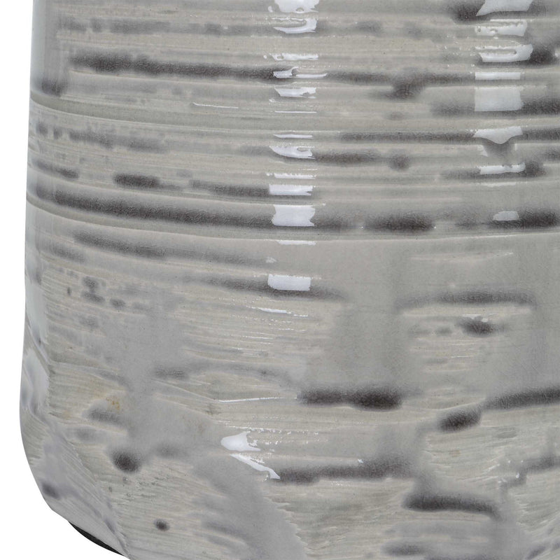Uttermost Cyclone Ivory table lamp featuring a sculpted base and fabric shade, ideal for modern or contemporary home decor.