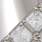 Lumi Source Topaz contemporary table lamp with a sleek design and neutral fabric shade on a wooden table.