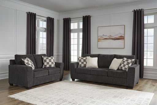 Benchcraft stationary chair and ottoman from Loreo living room set, with plush fabric and modern design.