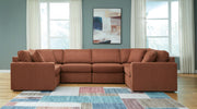 Signature Design by Ashley Modmax Spice stationary sectional sofa with plush cushions and modern design.