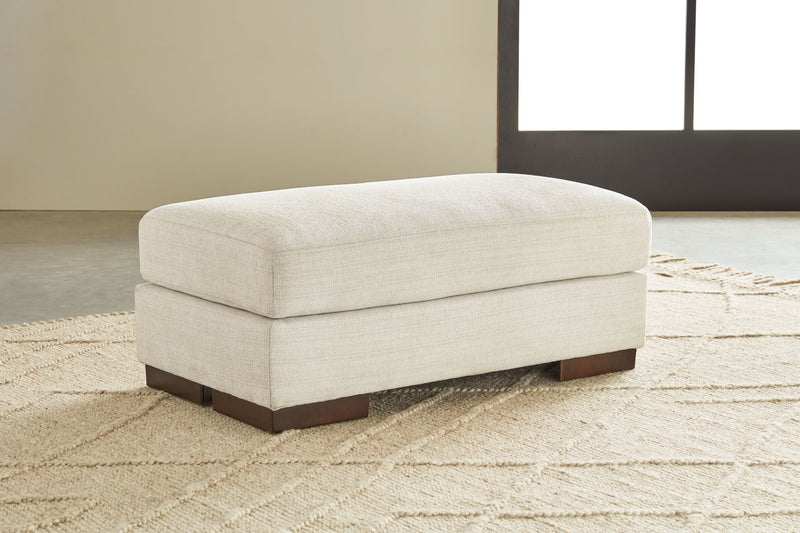 Signature Design by Ashley Maggie living room set with stationary chair and ottoman, featuring plush upholstery and modern design.