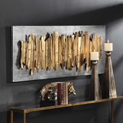 Uttermost Lev gold metal wall decor featuring a modern, abstract design suitable for contemporary interior wall decoration.