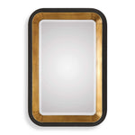 Uttermost Niva metallic wall mirror with a gold finish, showcasing a sleek round design and elegant frame.