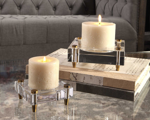 Pair of beige Claire crystal block candleholders from Uttermost, featuring modern geometric design for elegant tabletop decor.
