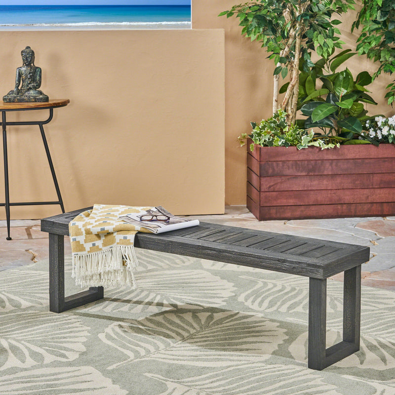 Dark gray Noble House Realm outdoor bench with slat panel top and base, showing sturdy wooden slats and sleek design.