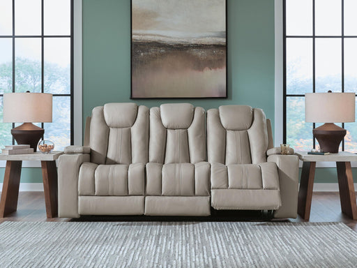 Signature Design by Ashley Elevate Edges reclining sofa with drop-down table in coin fabric, showcasing plush seating and built-in table feature.