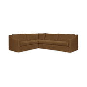 Classic Home Kipton upholstered corner sectional sofa with plush cushions and fabric upholstery in a modern living room setting.
