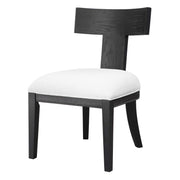 Uttermost Idris armless side chair with upholstered seat and wooden legs, modern design, shown from a front angle.