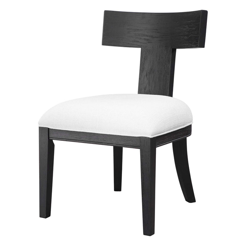 Uttermost Idris armless side chair with upholstered seat and wooden legs, modern design, shown from a front angle.