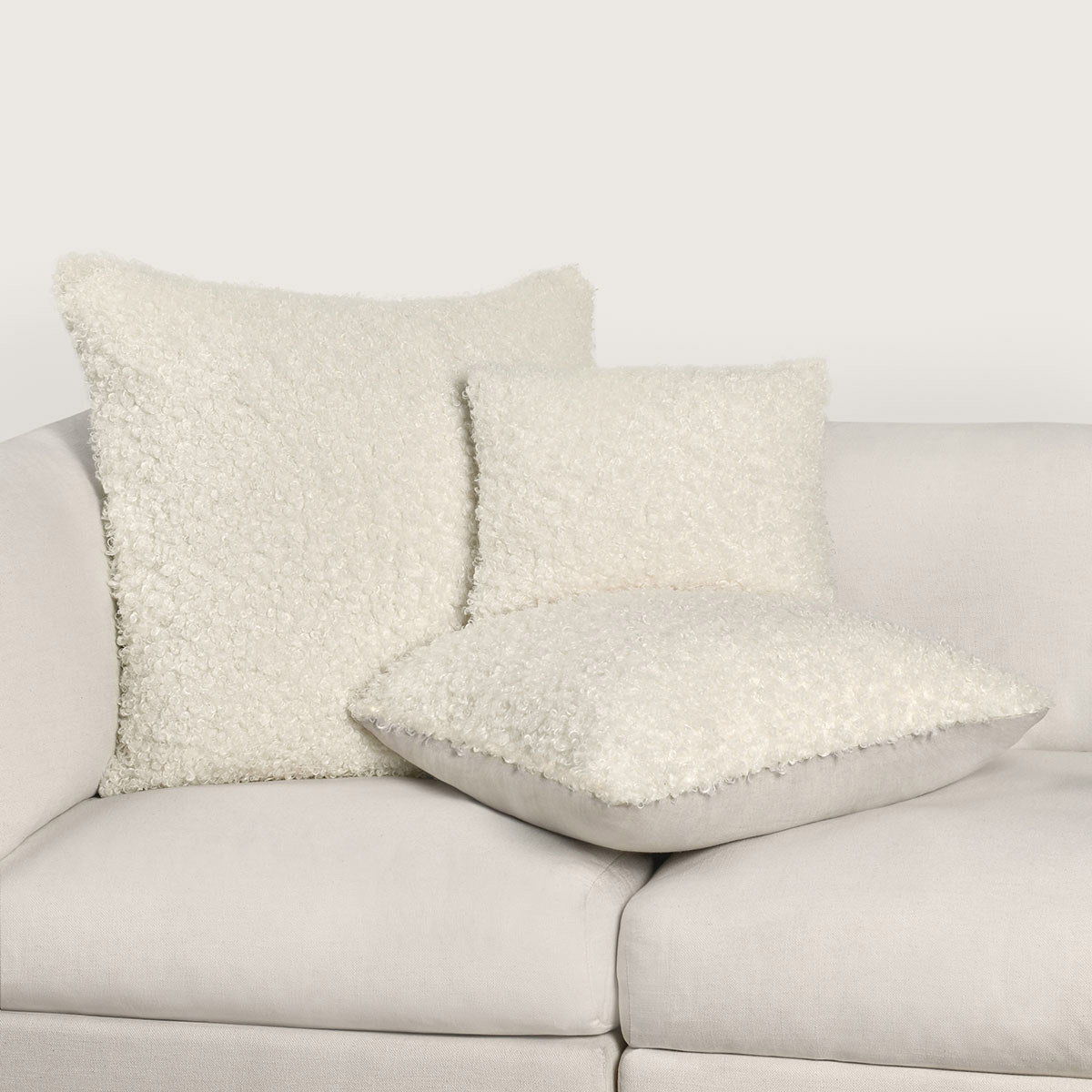 Ivory Carters accent pillow by Classic Home, 22x22 inches, with a soft fabric cover and decorative design.