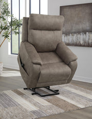 Signature Design by Ashley Crestmeade Power Lift Recliner in beige fabric with padded armrests and built-in lift mechanism.