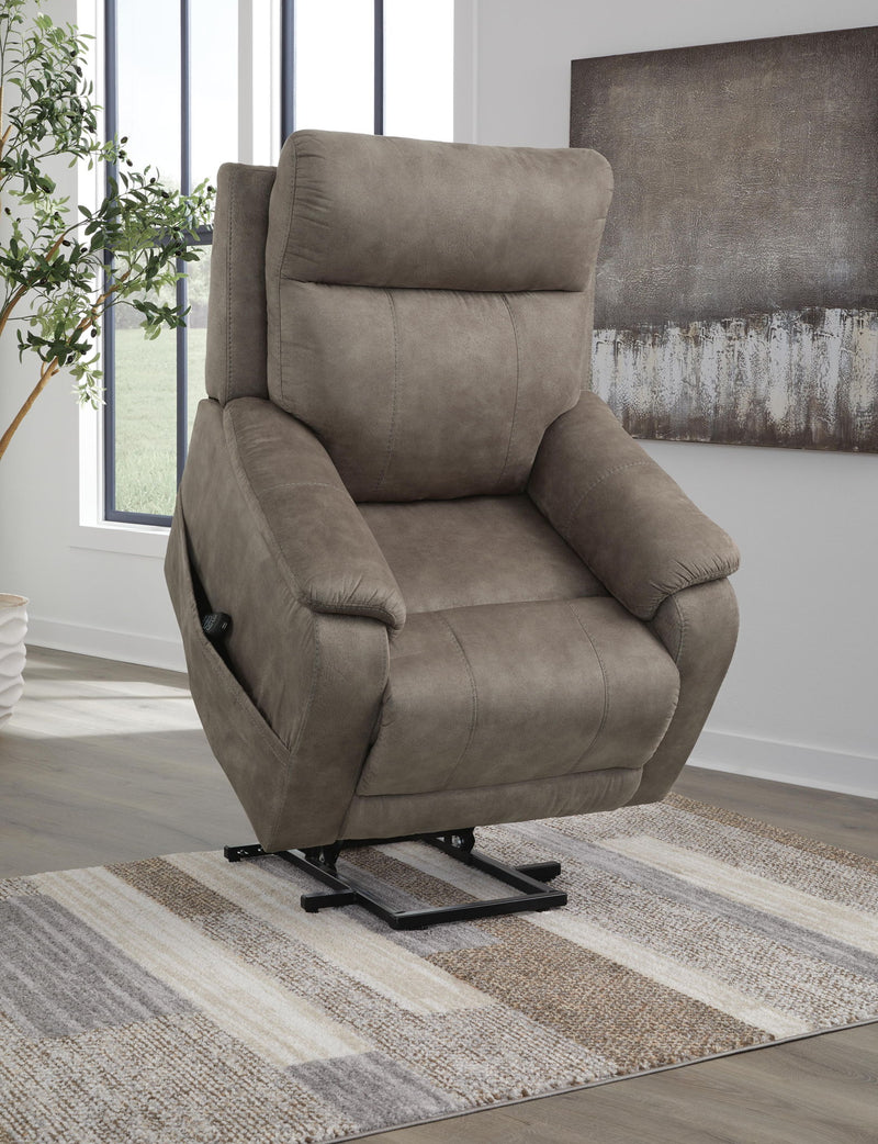Signature Design by Ashley Crestmeade Power Lift Recliner in beige fabric with padded armrests and built-in lift mechanism.