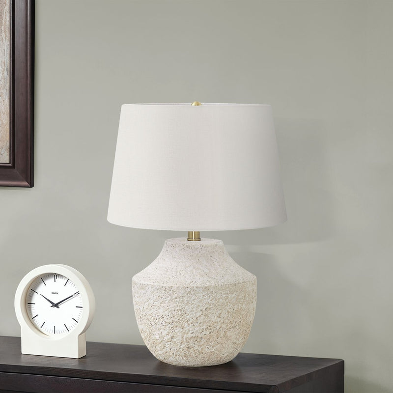 Modern concrete table lamp in cream color by 8th Street, featuring a sleek minimalist design and a cylindrical shape.