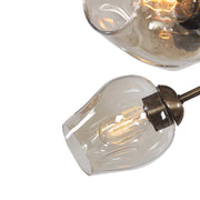 Uttermost Chet 12 Light Sputnik Chandelier with light brown finish, featuring a modern starburst design hanging from a ceiling mount.