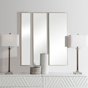 Set of three gold wall mirrors by Uttermost featuring modern round designs for stylish home decor.