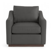 Classic Home Aspen accent arm chair with plush upholstery and wooden legs, shown in a cozy living room setting.