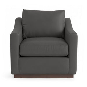 Classic Home Aspen accent arm chair with plush upholstery and wooden legs, shown in a cozy living room setting.