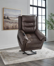 Signature Design by Ashley Oatman Power Lift Recliner in plush fabric with padded armrests and adjustable reclining features.