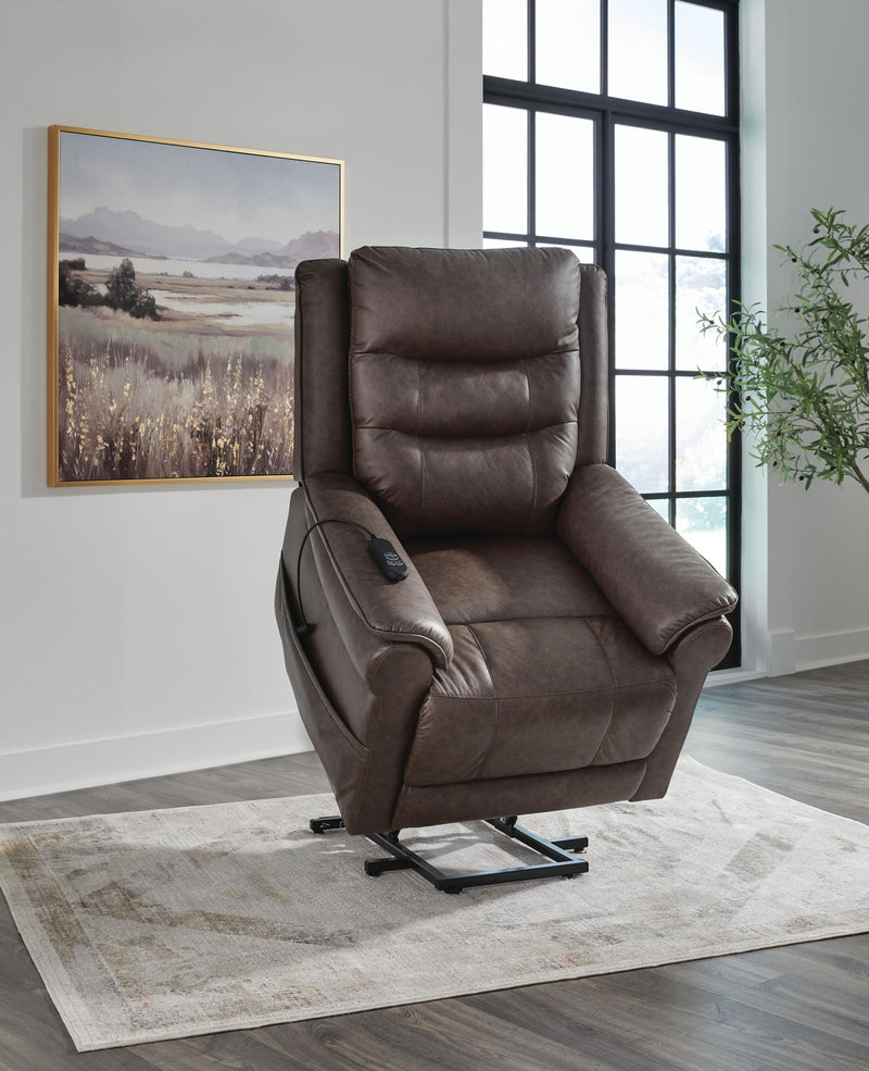 Signature Design by Ashley Oatman Power Lift Recliner in plush fabric with padded armrests and adjustable reclining features.