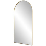 Uttermost Crosley Arch Mirror with antique brass finish, wall-mounted design featuring a sleek, curved frame and reflective glass surface.