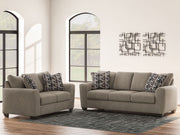 Benchcraft Triston-Peaks living room set with stationary chair and matching ottoman, featuring plush fabric and stylish design.
