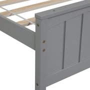 DreamHaus trundle platform bed with a sleek wooden frame, featuring a pull-out drawer for versatile sleeping and storage.