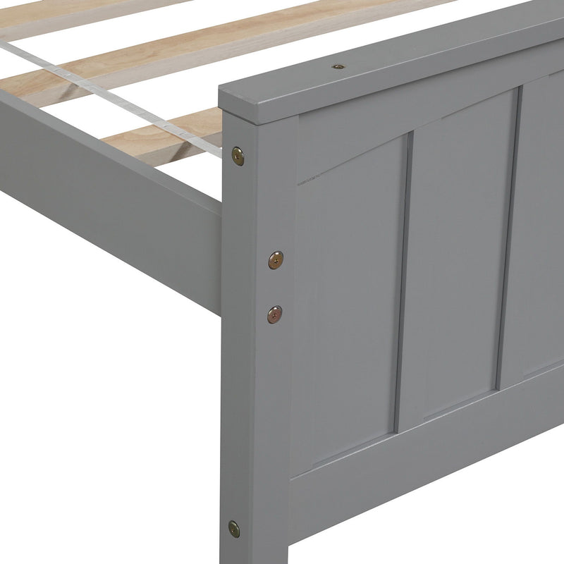 DreamHaus trundle platform bed with a sleek wooden frame, featuring a pull-out drawer for versatile sleeping and storage.