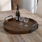 Dark brown round wooden tray from Uttermost's Reine collection, featuring a smooth finish and sturdy construction.