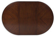 Lavinton - Oval Dining Room Extension Table - Brown - R&R Furniture Gallery (Fountain Valley, CA)