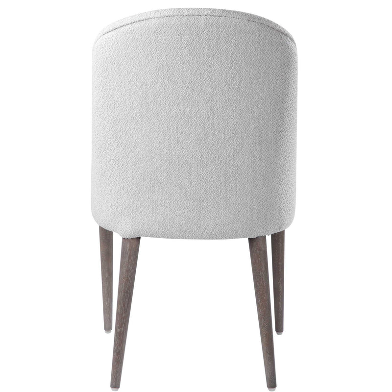 Pair of Uttermost Brie armless chairs set, modern design with upholstered seats and wooden legs, ideal for living spaces.