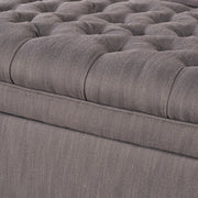 Noble House Juliana storage ottoman with birch wood legs, upholstered in neutral fabric, showing a cushioned top and storage space inside.