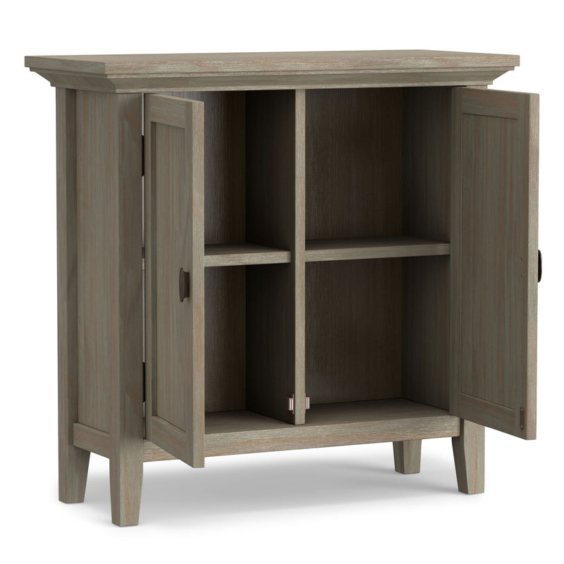 Redmond handcrafted low storage accent cabinet by Simpli-Home with a warm wood finish and minimalist design.