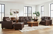 Signature Design by Ashley Santorine living room set with stationary chair and ottoman in a cozy, modern living space.