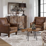 Dark brown reclaimed wood accent cabinet with two doors, crafted by Uttermost, featuring a rustic, natural wood finish.